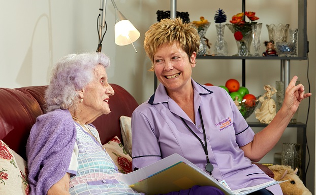 A carer and a women talking